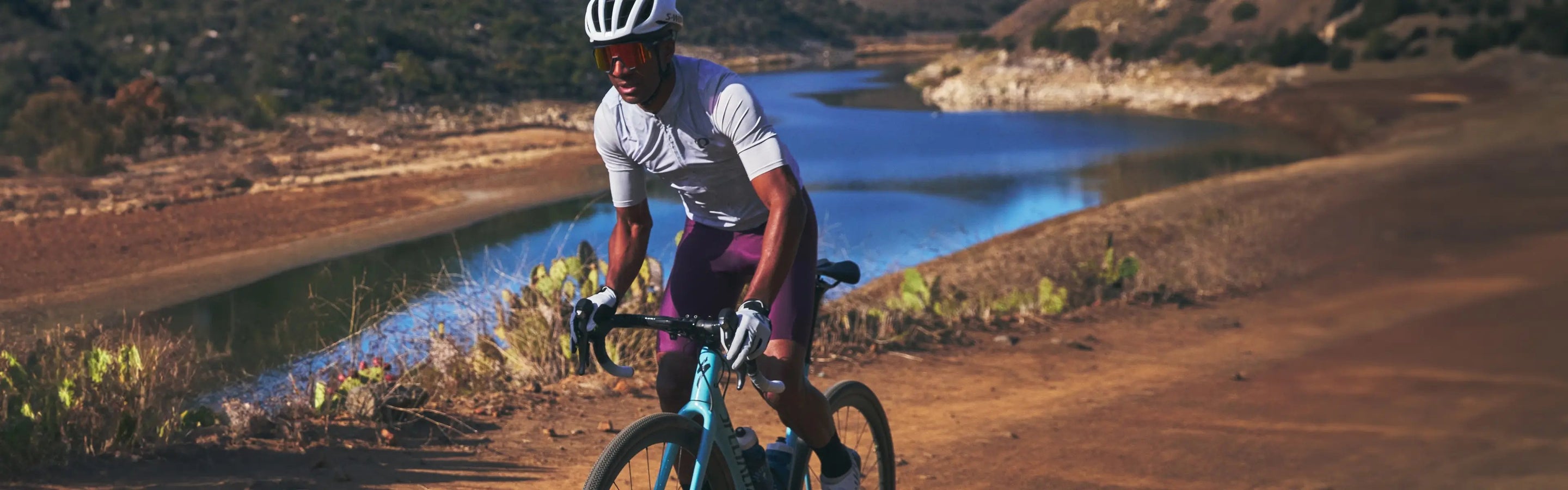 Two road cyclist riding on a mountain road in PEARL iZUMi kits